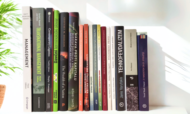 Photograph of new arrivals at CEK Library arranged on a shelf