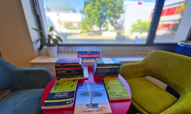 A selection of September new books displayed on a table in the CEK Library. The UL SEB atrium is visible in the background. The image accompanies the presentation of the library’s September new book arrivals.
