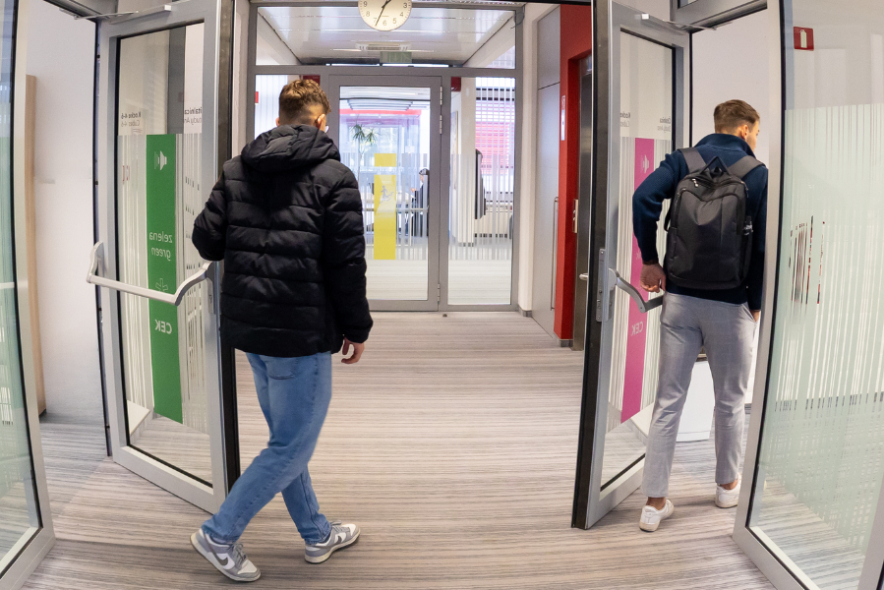 Two students entering the Pink and Green CEK study Areas