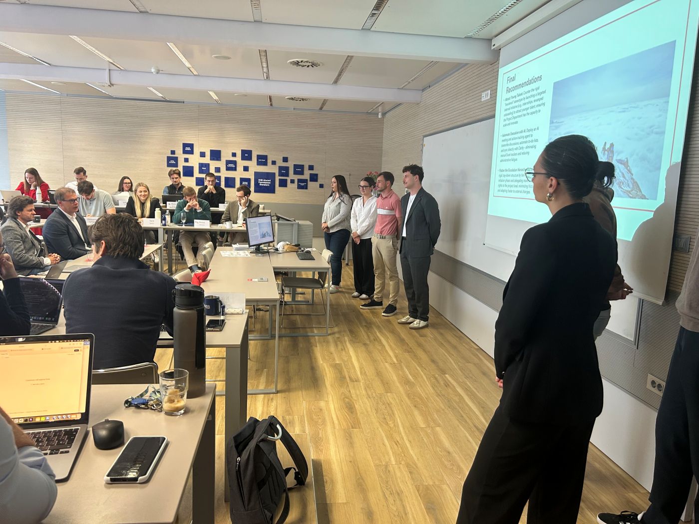 The students are presenting their project to company representatives.
